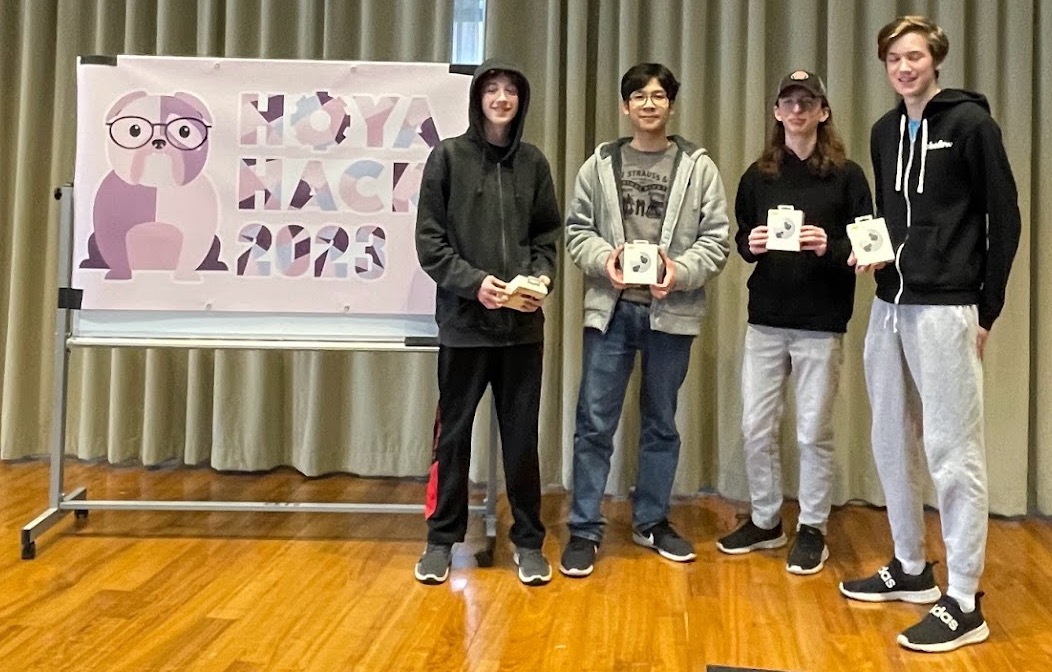 Photo of students with winning entry in Hoya Hacks 2023